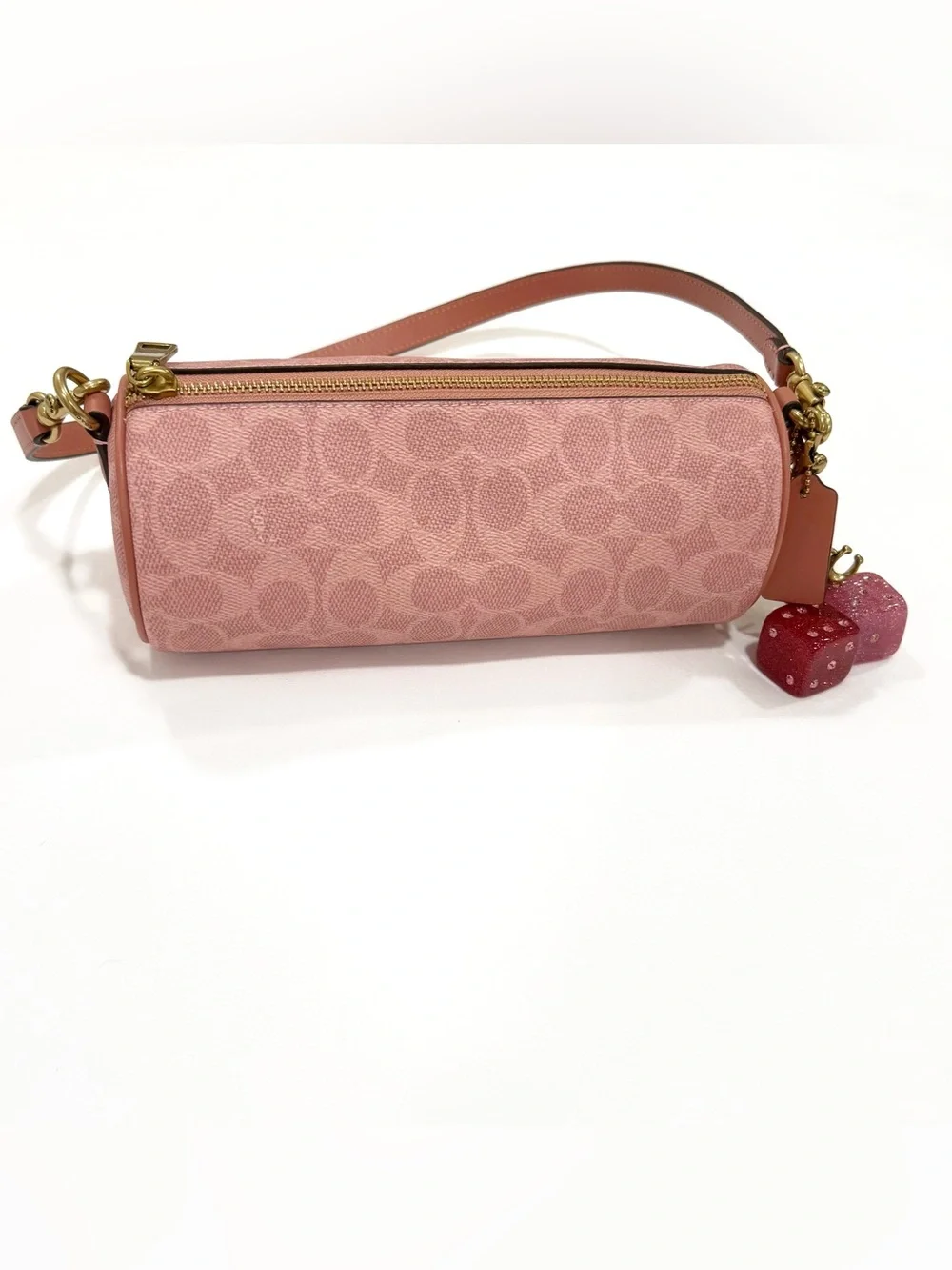 New Coach cylinder barrel bag in melon pink/ brass with signature canvas